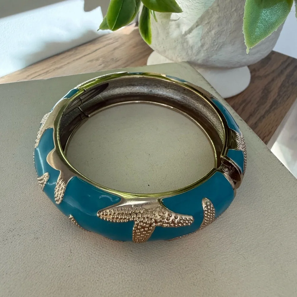 Starfish blue gold tone women’s bangle